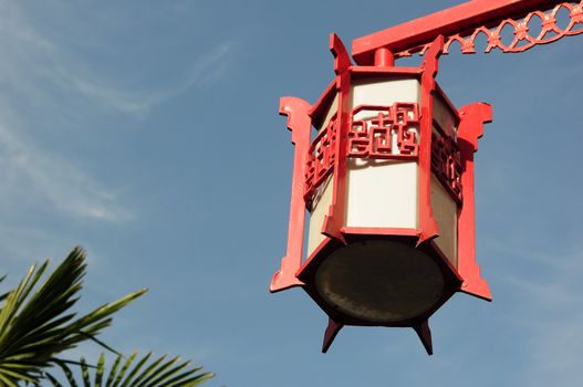 Red Chinese lantern against the blue sky