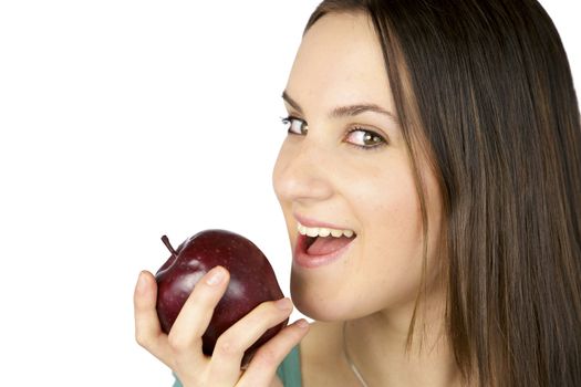 beautiful brunette female model ready to eat red apple