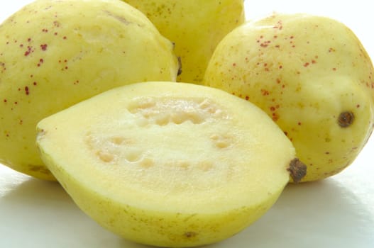 Closeup of cut and whole guava fruit