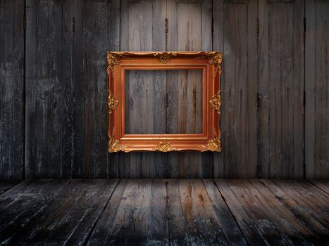 Old picture frame on wooden wall and Top light