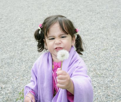 little girl with dandelions