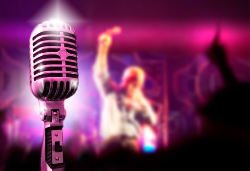 Music background with vintage microphone and concert