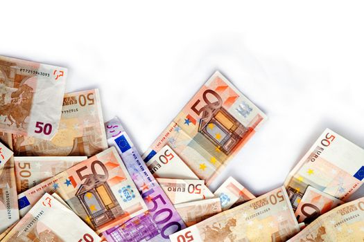 Close up image of several euro bills isolated in white