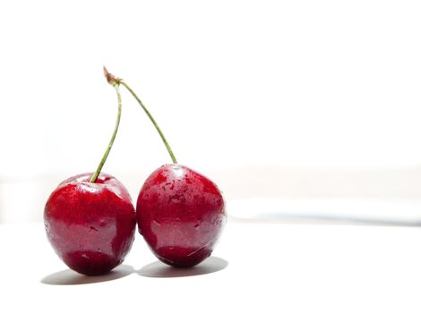 Still life with tasty cherries isolated in white