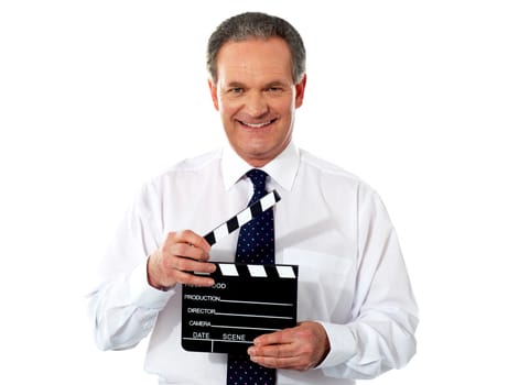 Aged corporate male holding clapperboard. Shot on white background