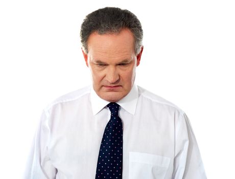 Closeup portrait of sad businessman looking down