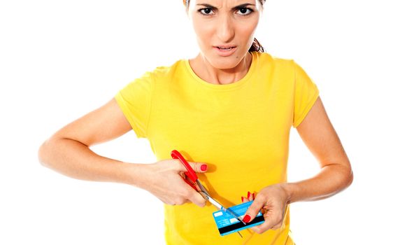 Annoyed teen customer destroying credit card. Isolated against white background