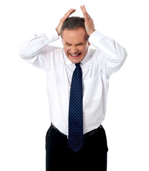 Aged businessman in depression standing with hands on his head