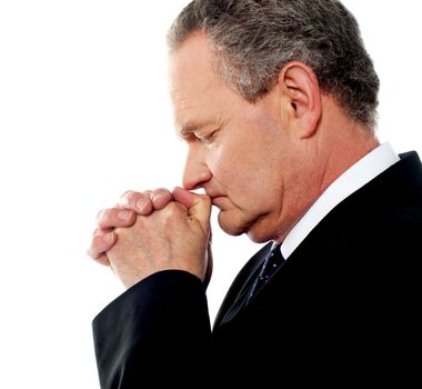Business person praying god to God. Eyes closed