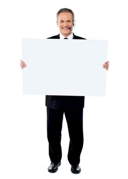 Businessman holding a blank billboard isolated on white background