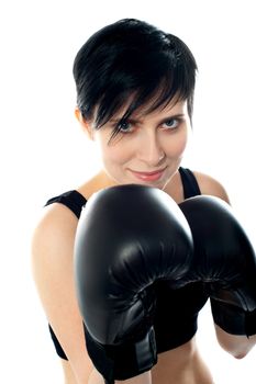 Attractive caucasian girl practicing boxing, isolated on white background