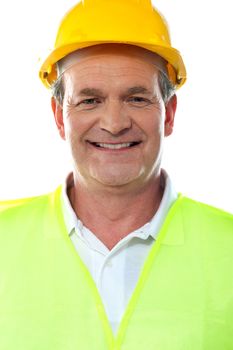 Smiling builder wearing hardhat. Closeup portrait