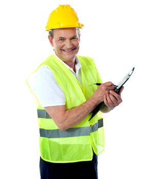 Happy senior construction engineer with safety hat and jacket