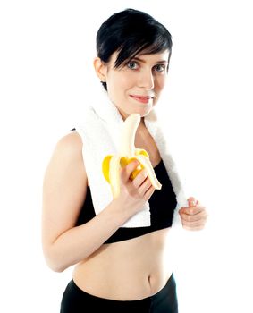 Pretty woman with banana isolated on white background