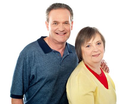 Portrait of an aged smiling couple looking at you