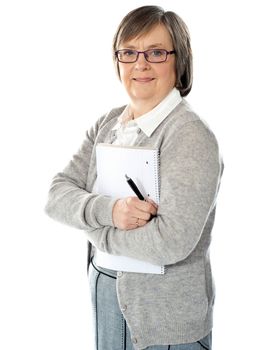 Senior woman with folder and pen isolated against white background