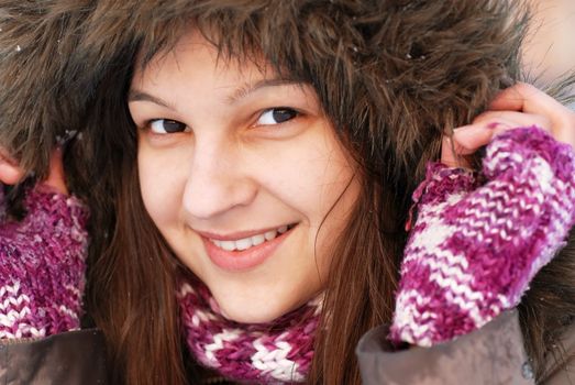 smiling teenager caucasian girl portrait in hood