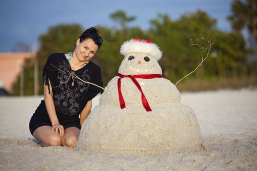 Christmas in Florida - girl and sandman on the beach