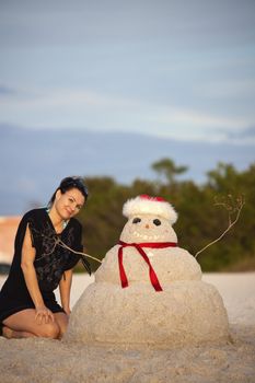 Christmas in Florida - girl and sandman on the beach