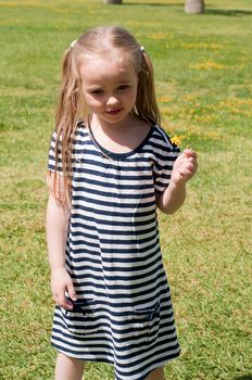 Little cute girl with long blond hair