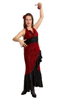 Young beautiful woman is dancing the Spanish dance with castanets isolated on white background
