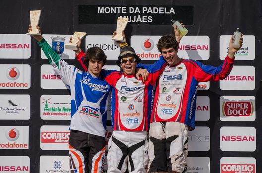 VIANA DO CASTELO, PORTUGAL - MAY 13: Cadet winner Rafael Sousa in the middle at the podium on the 4th Stage of the Taca de Portugal Downhill Vodafone on may 13, 2012 in Viana do Castelo, Portugal.
