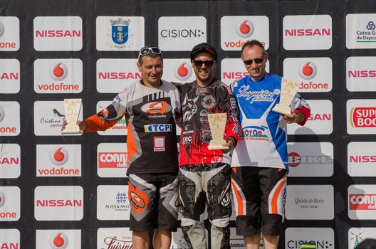 VIANA DO CASTELO, PORTUGAL - MAY 13: Master 40 winner Joao Estevao in the middle at the podium on the 4th Stage of the Taca de Portugal Downhill Vodafone on may 13, 2012 in Viana do Castelo, Portugal.