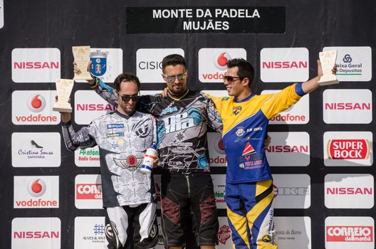 VIANA DO CASTELO, PORTUGAL - MAY 13: Master 30 winner Ruben Carril in the middle at the podium on the 4th Stage of the Taca de Portugal Downhill Vodafone on may 13, 2012 in Viana do Castelo, Portugal.