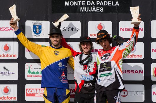 VIANA DO CASTELO, PORTUGAL - MAY 13: Junior winner Joao Gois in the middle at the podium on the 4th Stage of the Taca de Portugal Downhill Vodafone on may 13, 2012 in Viana do Castelo, Portugal.