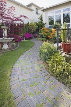 Frontyard Cement Stone Paver Path on Green Lawn with Water Fountain Vertical