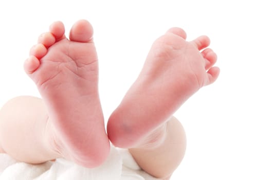 Close-up of a newborn baby feet over white background.