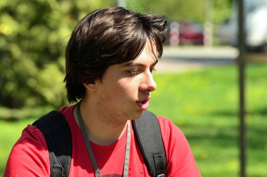 The photo shows a teenager who stopped to think about something.