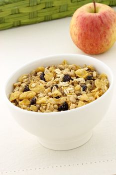 delicious and healthy granola or muesli with a fresh organic apple and lots of dry fruits, nuts and grains.