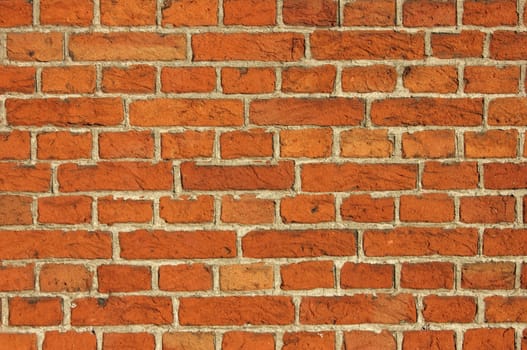 Red Bricks Wall background shot in the warm light of the sunset. 