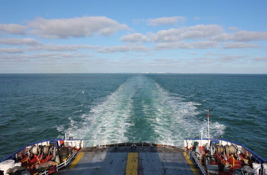 Ferry Boat traveling at full speed toward Calais in a clear bright day.