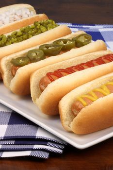 hot dogs on a nice table setting rich textures colors and flavors    