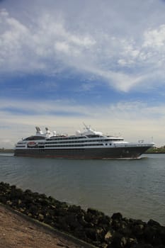 Small cruise ship leaving locks on its journey to the sea