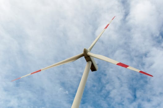close-up portrait of wind turbine in blue sky
