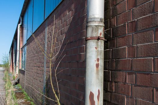 detail shot of an abandoned factory with broken windows