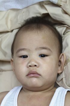 Baby boy in a high chair