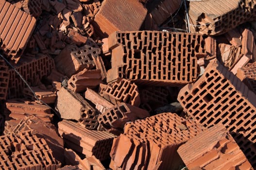 Heap of beaten red brick - grunge background