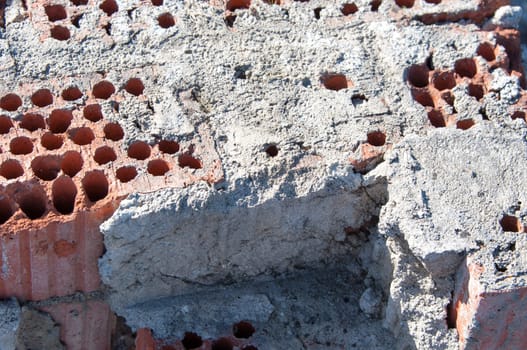 Closeup of raw state red brick wall with mortar