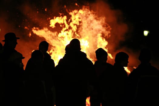 Close-up of some people coming out of fire