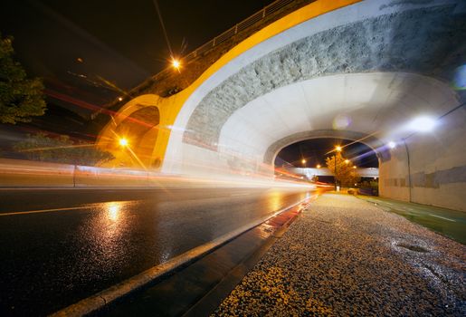 Night urban scene with tunnel