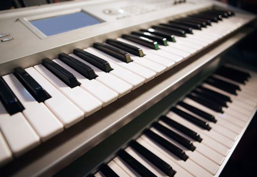 Close up image of two pianos