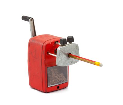 Mechanical sharpener of pencil on the white background