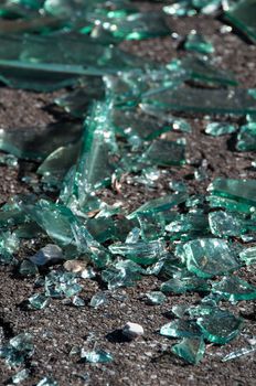 Soil covered with pieces of broken glass