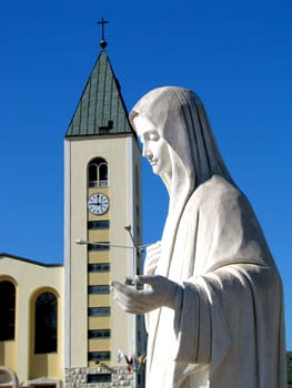 The statue of Our Lady Queen of Peace in the church square of St. James in Medjugorje, Bosnia - Herzegovina.