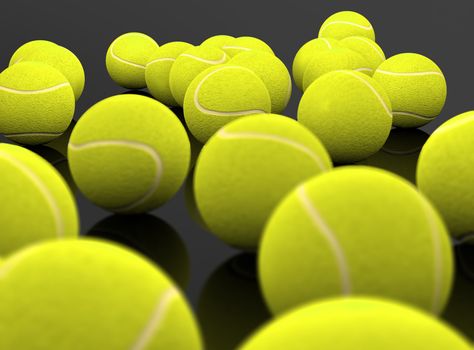 3d image of several tennis ball isolated in black background