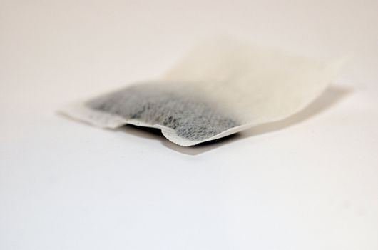 Isolated tea bag against white background with copy space